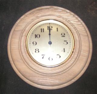 Wall clock in ash mount